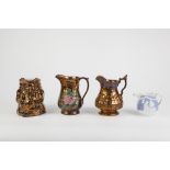 THREE NINETEENTH CENTURY MOULDED COPPER LUSTER JUGS, including one of Toby form, a/f, TOGETHER