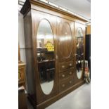 LATE NINETEENTH CENTURY INLAID OAK BEACONSFIELD TYPE WARDROBE WITH TWO OVAL MIRROR PANEL DOORS (A.