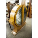 ART DECO WALNUT DISPLAY CABINET, of circular form with leaded glass doors, 50" high, some losses