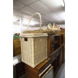 A WICKER LINEN BASKET AND COVER, AN OBLONG GILT FRAMED WALL MIRROR, ANOTHER MIRROR AND A QUANTITY OF