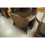 AN EARLY TWENTIETH CENTURY OAK BOOKCASE, RAISED BACK OVER THREE SHELVES AND AN EARLY TWENTIETH