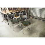 A SET OF FOUR MID TWENTIETH CENTURY TUBULAR METAL CANTILEVER SINGLE CHAIRS WITH HIDE BACKS AND SEATS