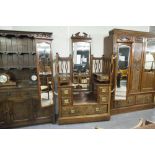 A VICTORIAN BEDROOM SUITE OF THREE PIECES VIZ, A TRIPLE WARDROBE WITH MIRRORS TO EACH DOOR, TWO