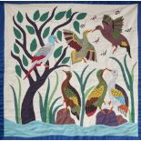 FABRIC COLLAGE WALL HANGING depicting colourful birds, butterflies and foliage, on a white