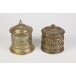 PROBABLY INDIAN EMBOSSED BRASS CYLINDRICAL TOBACCO JAR AND COVER strapwork and lions mask