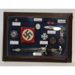 GLAZED DISPLAY CASE CONTAINING REPRODUCTION THIRD REICH MEMORABILIA, including a Nazi Shutzstaffel