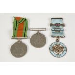 TWO GEO VI SERVICE MEDALS viz 1939/45 war medal and defence medal one only with ribbon and a 1954