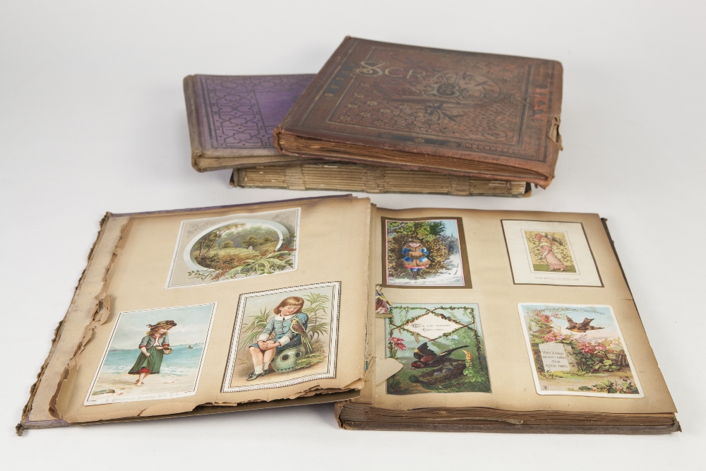 TWO VICTORIAN SCRAP BOOKS with pictorial covers and OTHER VICTORIAN SCRAP ALBUMS containing a