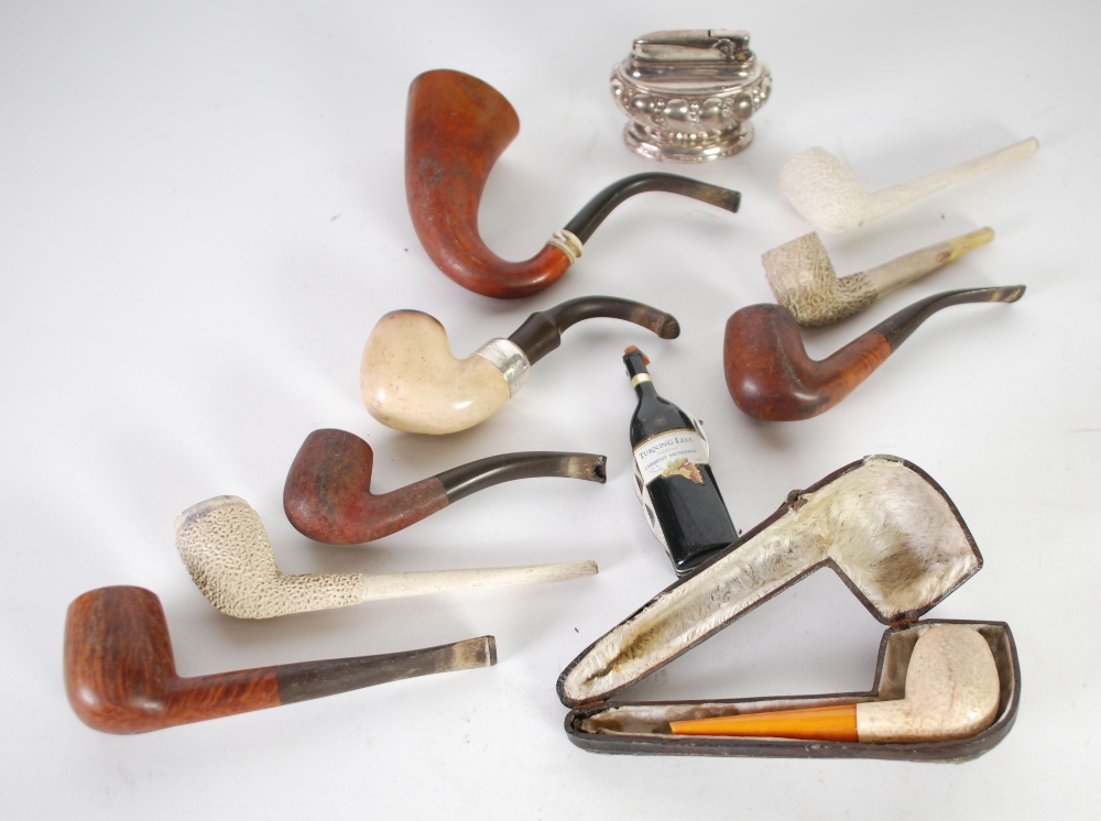 COLLECTION OF NINE SMOKING PIPES comprising four with wooden bowls, a Peterson's of Dublin example