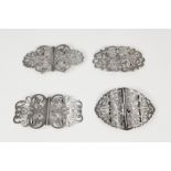 FOUR LATE VICTORIAN AND EDWARDIAN TWO PART SCROLL PIERCED AND ENGRAVED SILVER BUCKLES, 3 ¼" x 2" (