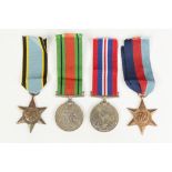 GROUP OF FOUR WORLD WAR II SERVICE MEDALS INCLUDING AIR CREW EUROPE STAR AWARDED TO FLYING OFFICER