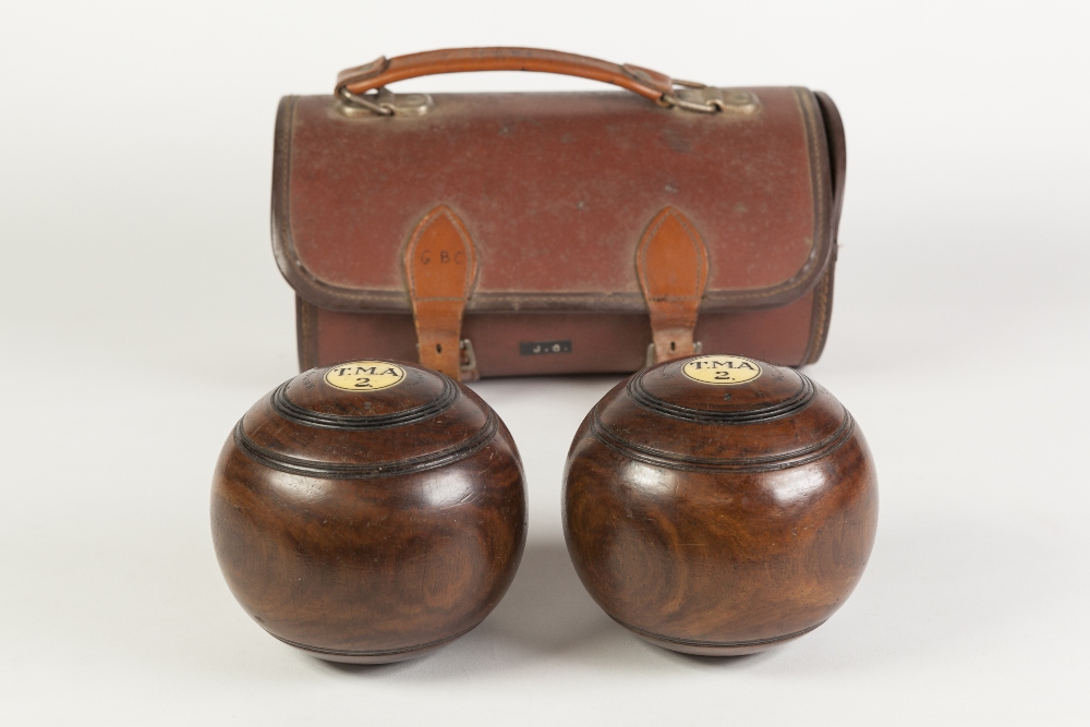 CASED PAIR OF H. WEBLEY (MANCHESTER) ROSEWOOD B IASED BOWLS, each with an inset roundel inscribed