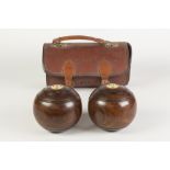 CASED PAIR OF H. WEBLEY (MANCHESTER) ROSEWOOD B IASED BOWLS, each with an inset roundel inscribed