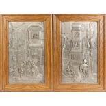 PAIR OF MID TWENTIETH CENTURY W.M.F. EMBOSSED PEWTER COLOURED METAL PLAQUES, of bygone continental