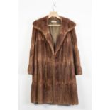 A FRAN KLINS TAN BROWN RABBIT 3/4 FUR COAT, fold over collar, front deam pockets. hook eye