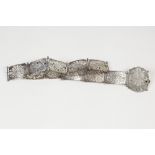 EDWARD VII FOURTEEN LINK PIERCED SILVER BELT, each link of shaped oblong form with central floral