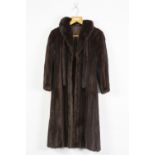 A DARK BROWN MINK FULL LENGTH LADIES COAT, fold over collar, neck tie, front slit pockets ,hook