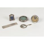 THREE VERY SMALL SILVER EASEL PHOTOGRAPH FRAMES, one having pointed arch, the other two circular,