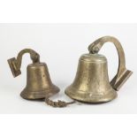 HEAVY BRASS BULKHEAD TYPE BELL pivoting on a scroll shaped wall bracket, 8" (20.3cm) diameter and