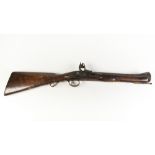 19th CENTURY FLINTLOCK BLUNDERBUSS OF CRUDE CONSTRUCTION with oak, full stocked, typical barrel,