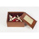 AN EARLY TWENTIETH CENTURY NATURAL AND RED STAINED BONE CHESS SET, 32 pieces, unmarked, contained