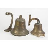 HEAVY BRASS BULKHEAD TYPE BELL pivoting on a scroll shaped wall bracket, 8" (20.3cm) diameter (lacks