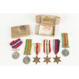 TWO SECOND WORLD WAR DEFENCE MEDALS, also a 1939-45 Service medal, Africa Star, Italy Star and
