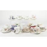 COLLECTION OF THIRTY VICTORIAN AND LATER CERAMIC MOUSTACHE CUPS AND SAUCERS, including: Edward VII