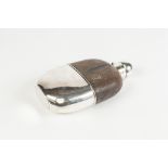 LIZARD OR SNAKE SKIN PART COVERED GLASS HIP FLASK, with plated bayonet hinged cover and pull off cup