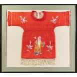 CHINESE EMBROIDERED SILK CHILD'S RED DRESS, worked in coloured threads with a sage and flowers