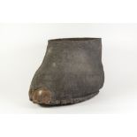 TAXIDERMY- AN ELEPHANT'S FOOT RECEIVER, 13" (33cm) high, a border of small holes just below the