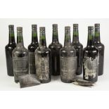 NINE OLD BOTTLES OF GILBEY'S TRIPLE CROWN PORT, three with loose labels and all other labels