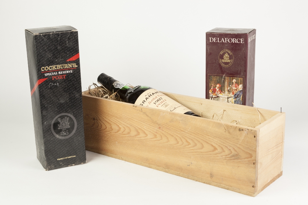 BOTTLE OF GRAHAM'S PORT, 1987, in wood case, together with TWO OTHER 70cl BOTTLES OF PORT IN CARD