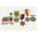 FOUR WORLD WAR II MEDALS, comprising: THE AFRICA STAR, THE STAR, THE DEFENCE MEDAL, no ribbon