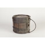 AGED AND RUSTIC COOPERED OAK SMALL BARREL WITH CAST IRON FOLDING HANDLE, of typical form, the ends