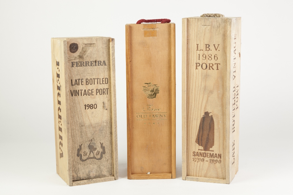 THREE BOTTLES OF PORT IN WOODEN SLIDE TOP BOXES, comprising: FERREIRA, 1980, 1ltr, SANDEMAN,