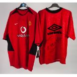 TWO SIGNED MANCHESTER UNITED FOOTBALL SHIRTS, one (Umbro) with five signatures, including: Lee