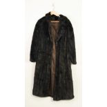 A FULL LENGTH DARK MINK COAT