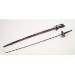 AN AGED AFGHAN OR INDIAN SWORD, with steel hilt and wooden grip, the fullered blade held within a