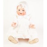 AN EARLY TWENTIETH CENTURY ARMAND MARSEILLE BISQUE HEAD BABY DOLL, with sleeping blue eyes and