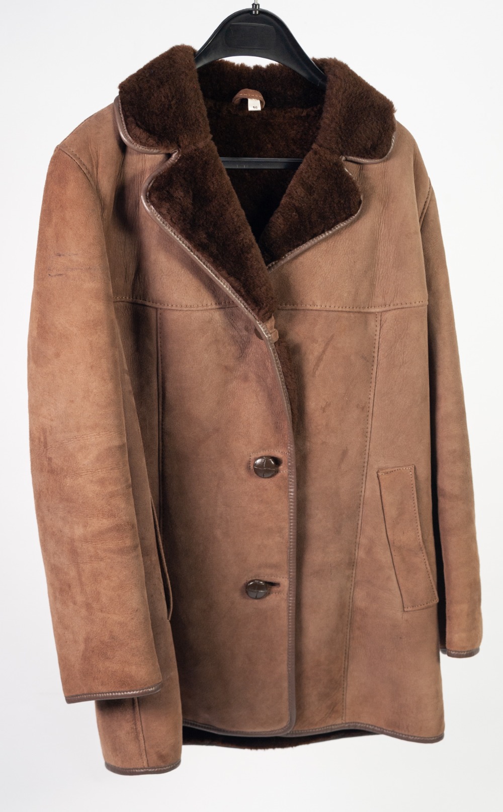 LADY'S BROWN SHEEP SKIN THREE QUARTER LENGTH JACKET, with reversed and revered collar, leather trim,