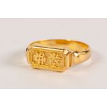 CHINESE GOLD COLOURED METAL RING, the rectangular top, chased with Chinese characters (tests as high