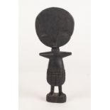 AN AGED AFRICAN TRIBAL CARVED WOODEN FIGURE, 8 1/2" (21.5cm)