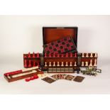 A VICTORIAN COROMANDEL WOOD GAMES COMPENDIUM with natural and red stained ivory CHESS SET (one piece