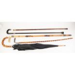 FOUR SILVER, WHITE METAL AND PINCH BECK MOUNTED AND OTHER WALKING STICKS, also an UMBRELLA (5)