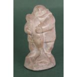 A CANADIAN INUIT STONE CARVING of an Inuit holding a large fish, incised 'Abbott, Canada', 6 1/2" (