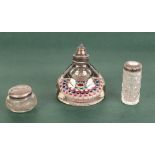 A WHITE METAL TOPPED MILLEFIORI GLASS PAPERWEIGHT CUM INKWELL, also two silver topped dressing table