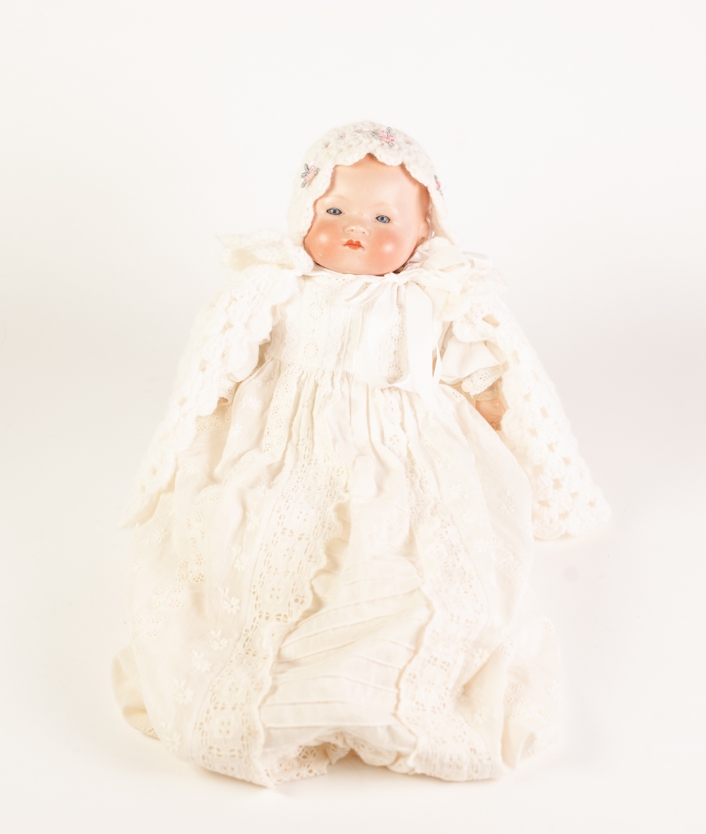 A SMALL EARLY TWENTIETH CENTURY ARMAND MARSEILLE BISQUE HEAD BABY DOLL with sleeping blue eyes and