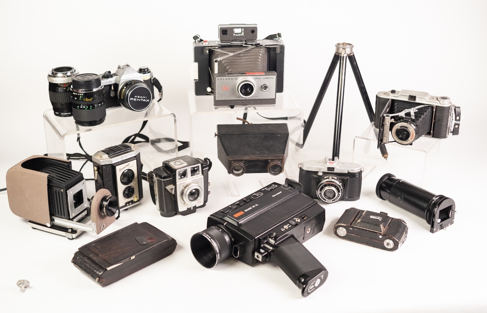 EIGHT VARIOUS PENTAX, KODAK AND OTHER CAMERAS, a CINE CAMERA in case, a folding TRIPOD, a