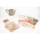 THREE ALBUMS OF WORLD POSTAGE STAMPS, a few BANKNOTES, assorted coinage, E.P.B.M. TEAPOT, AND A